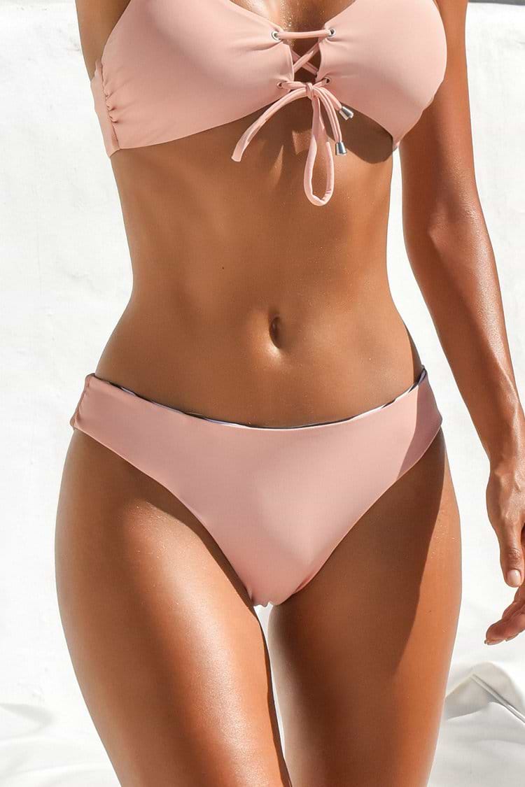 Bas de bikini réversible taille basse rose et rayé