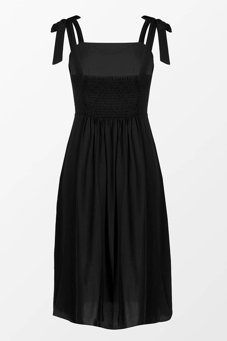 Robe midi noire à nœuds sur l'épaule