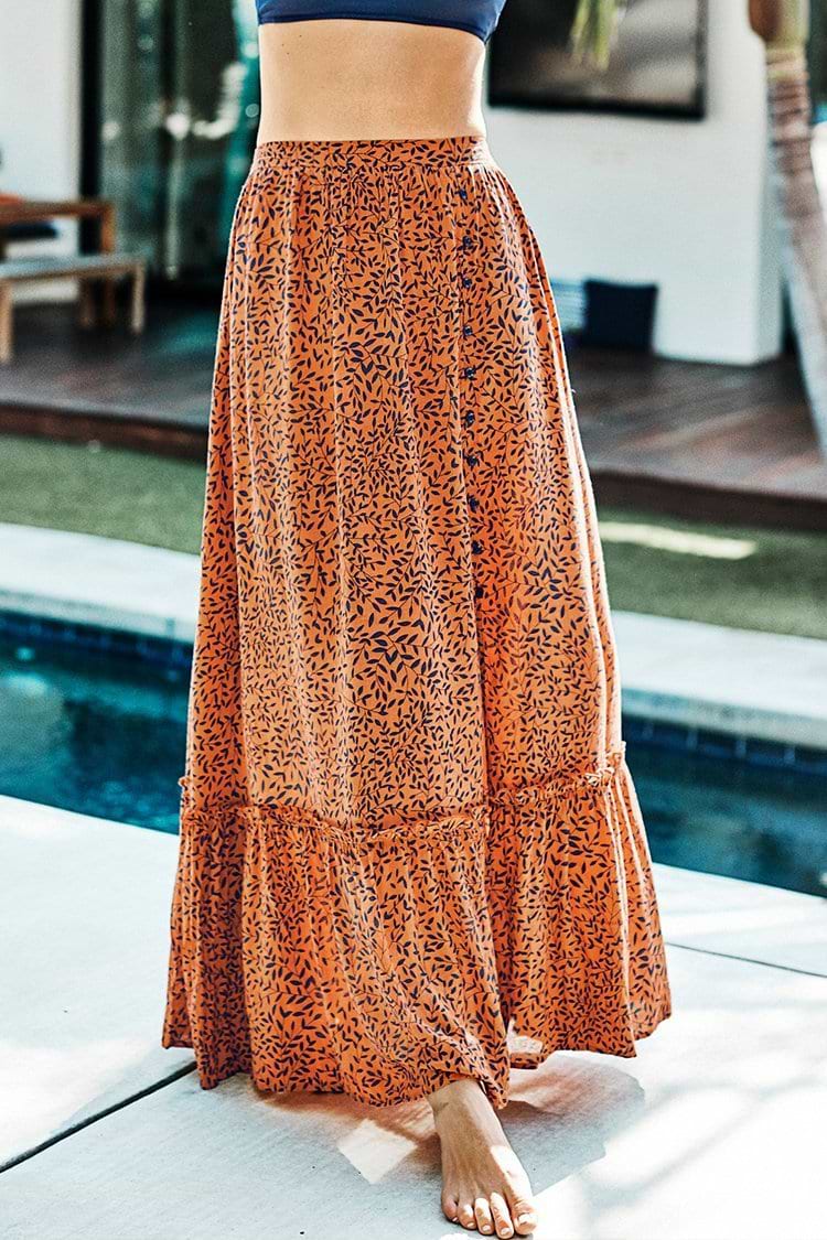 Jupe longue boutonnée à imprimé feuilles dorées et bleu marine