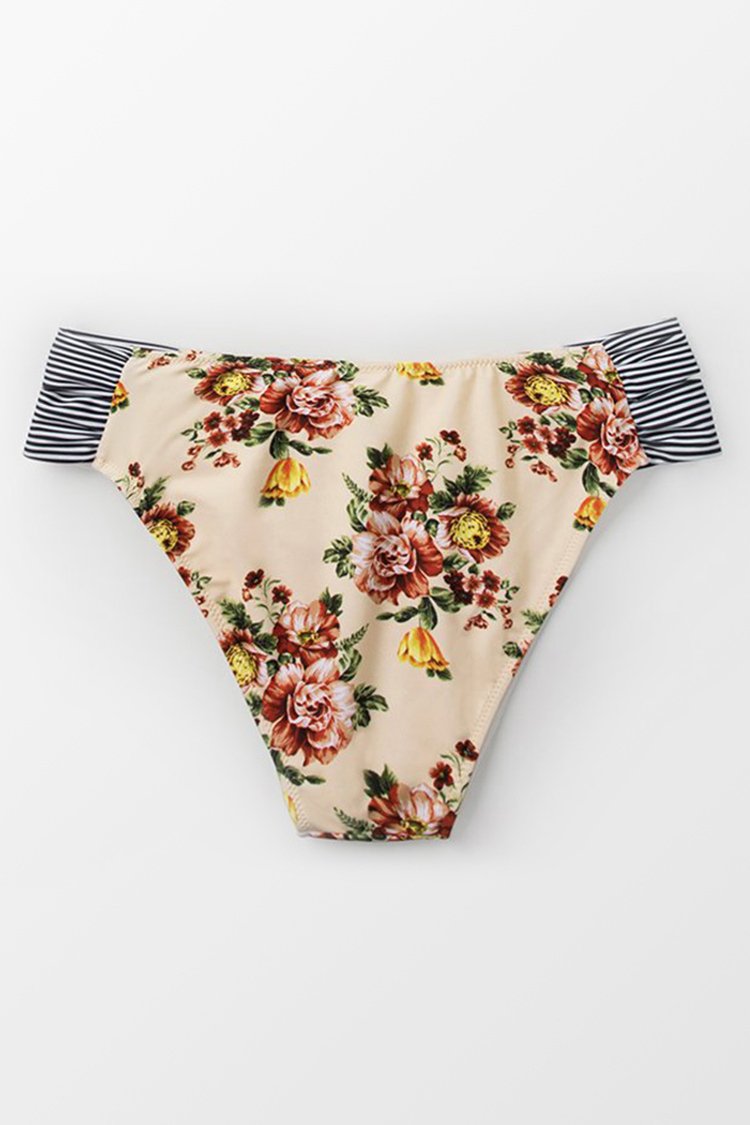 Bas de bikini à fleurs aux côtés coupés de biais