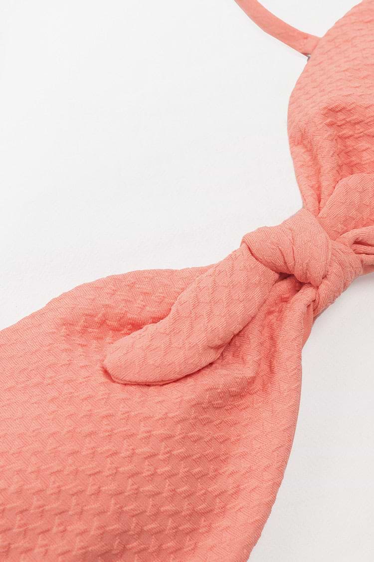 Haut de bikini bandeau texturé noué sur le devant