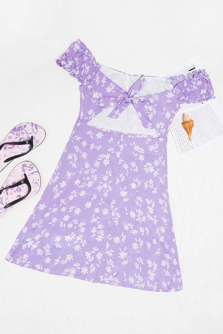 Robe à découpes avec nœud papillon et volants