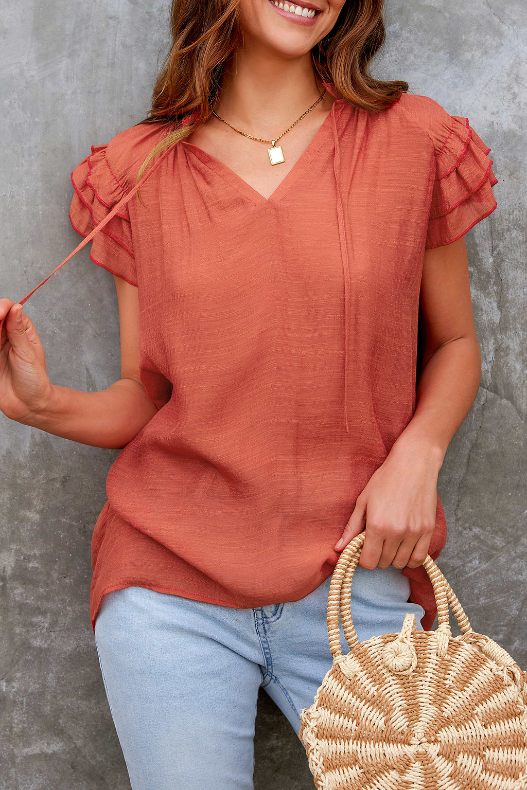 Top con lazo en la parte delantera con volantes