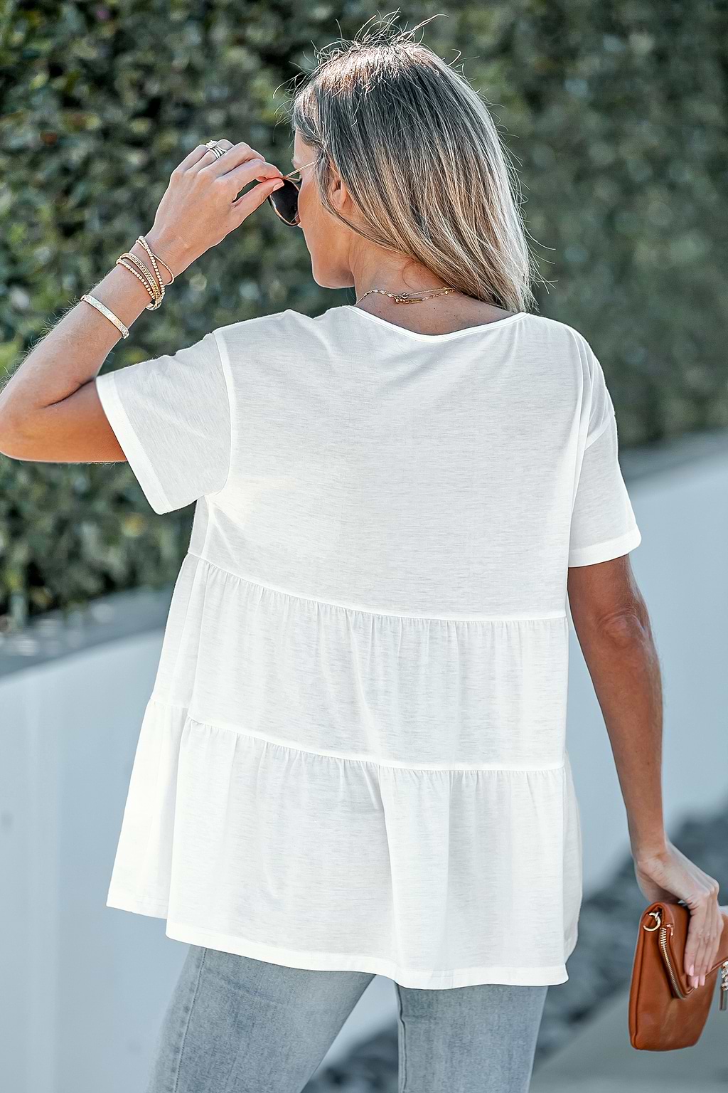 Camiseta de manga caída con dobladillo escalonado