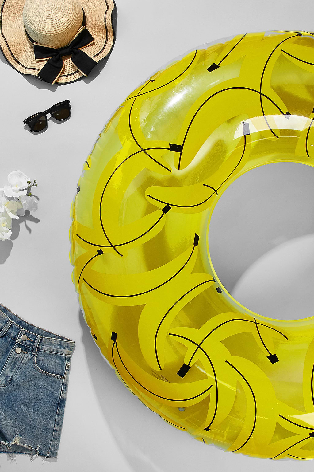 Gele bananenzwembadvlotter