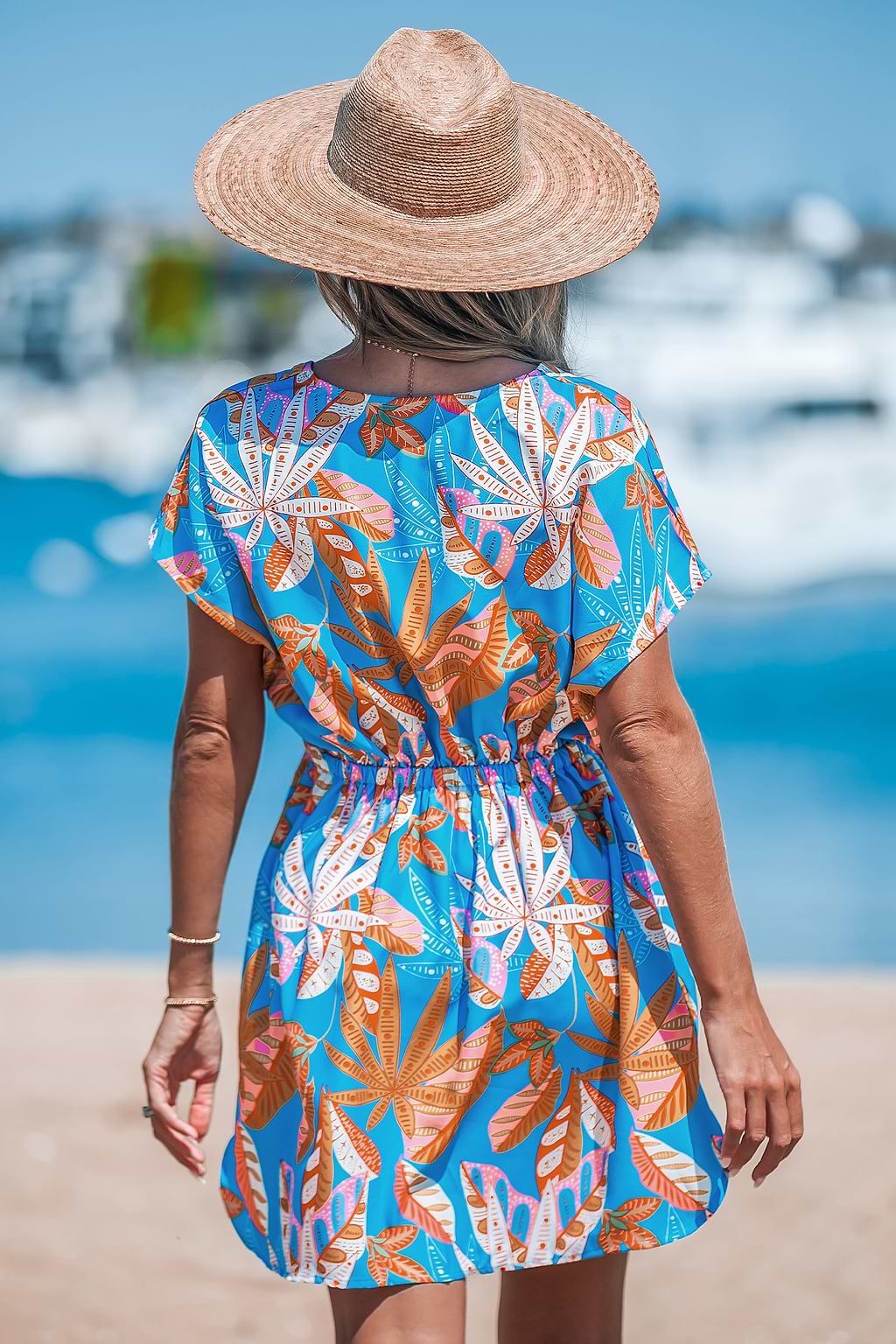 Blauwe tropische mini-cover-up met V-hals en dolman-mouwen