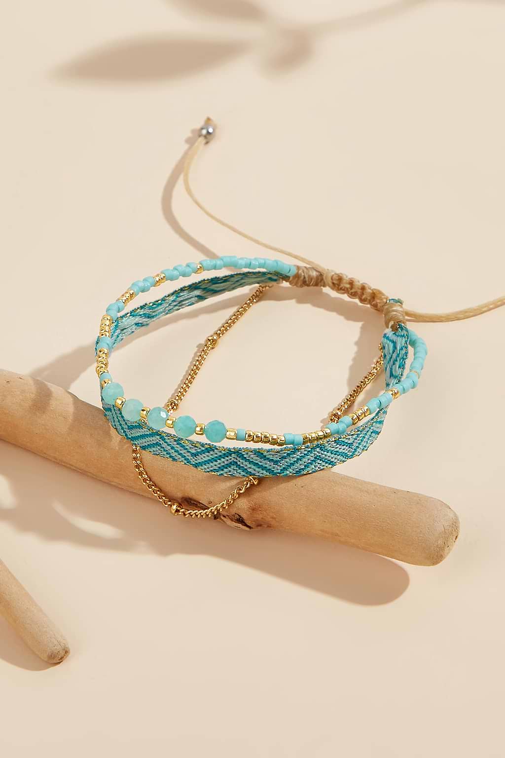 Conjunto de pulsera en tono dorado y turquesa sintética