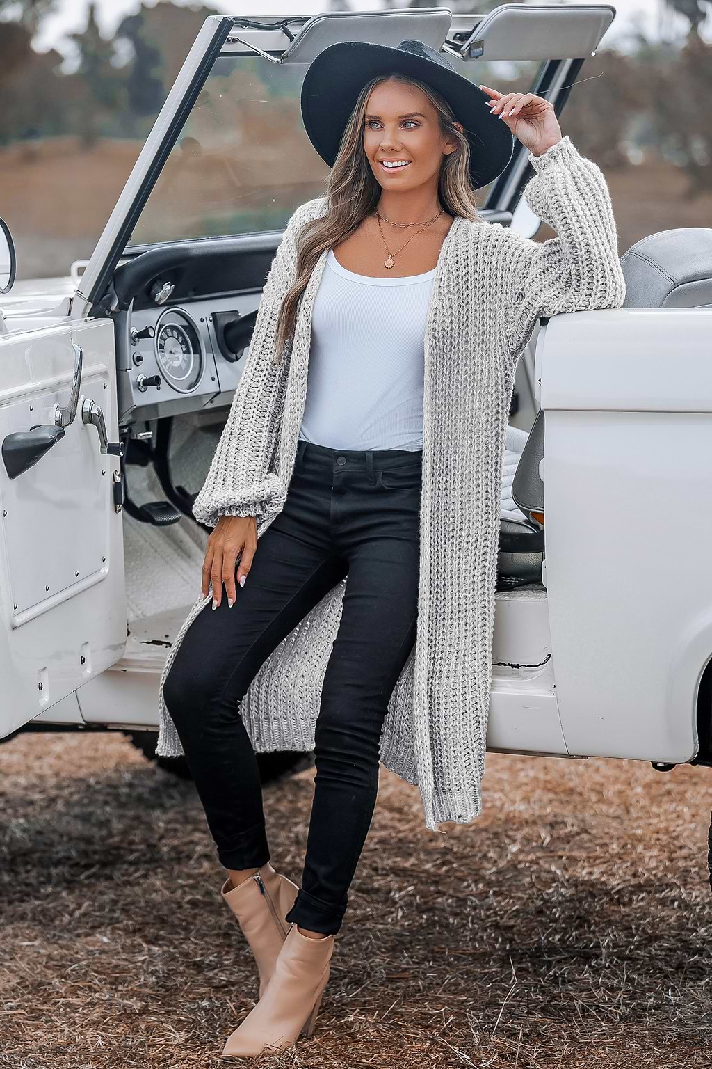 Abrigo de punto gris claro de manga larga con abertura delantera