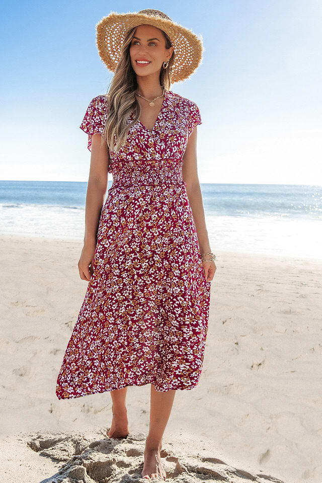 Rode midi-jurk met smokwerk in de taille