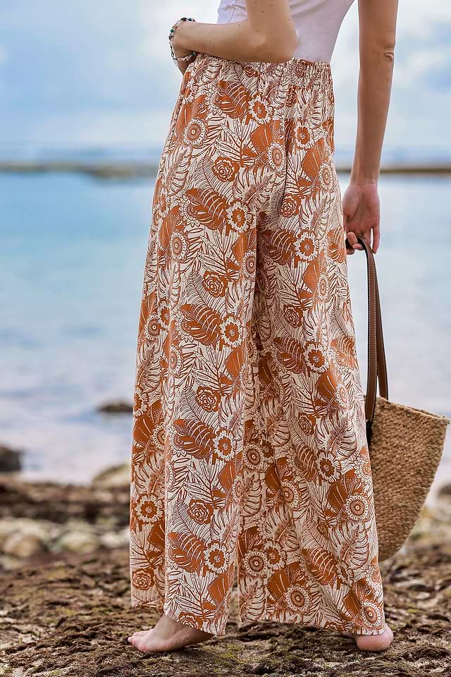 Pantalon large taille à smocks et fleurs