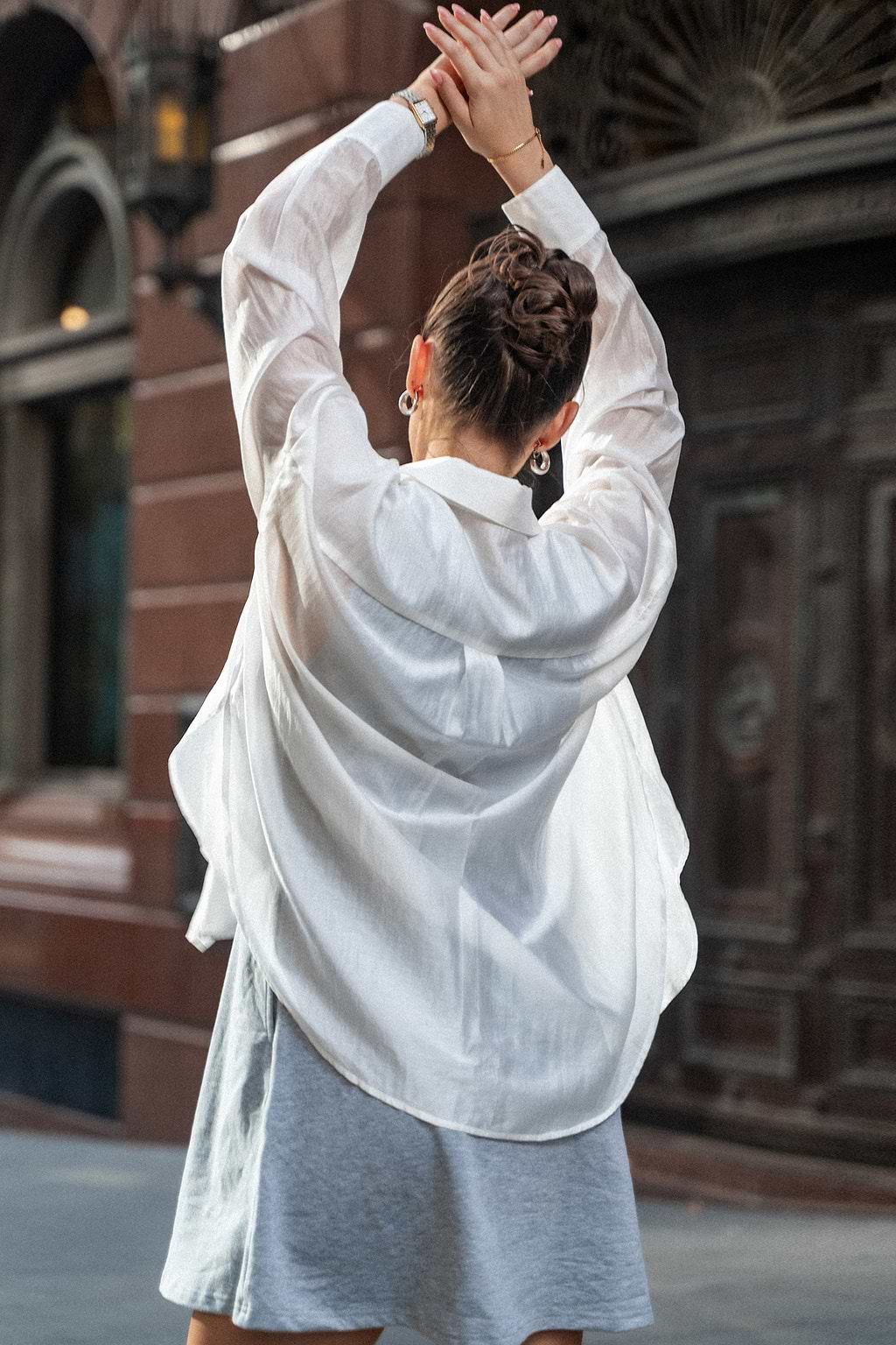 Witte blouse met lange mouwen en knopen