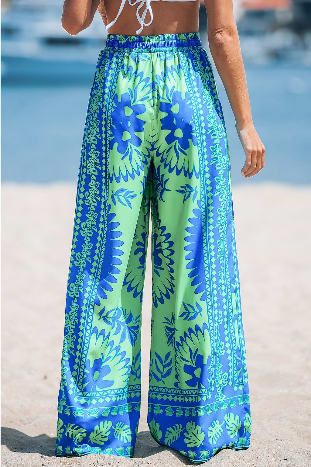 Pantalones de talle alto con estampado floral tropical