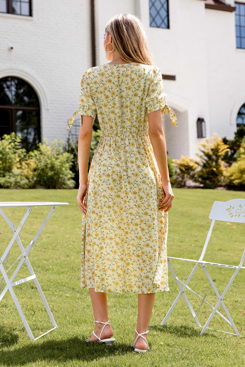 Gele midi-jurk met bloemenprint en pofmouwen