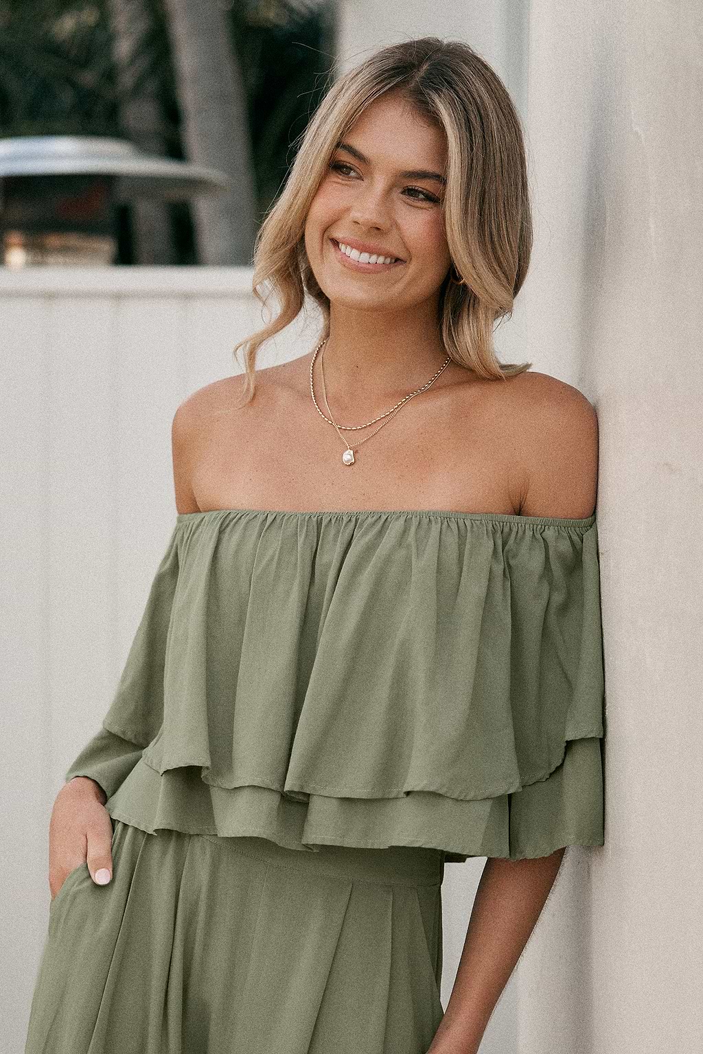 Grüne Off-Shoulder Bluse mit Stufenmuster