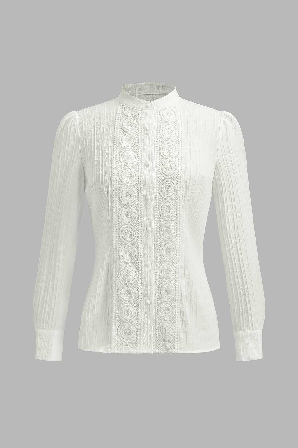 Blusa blanca de manga larga con hombros abullonados y cuello alto