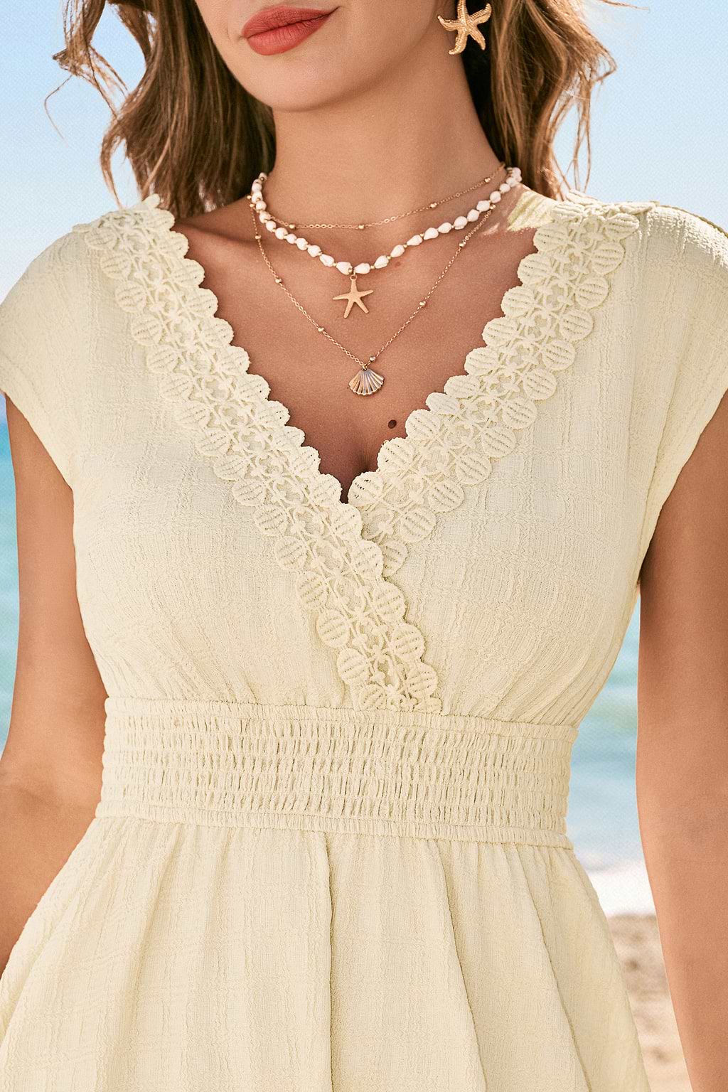 Mini abito beige con sole al tramonto