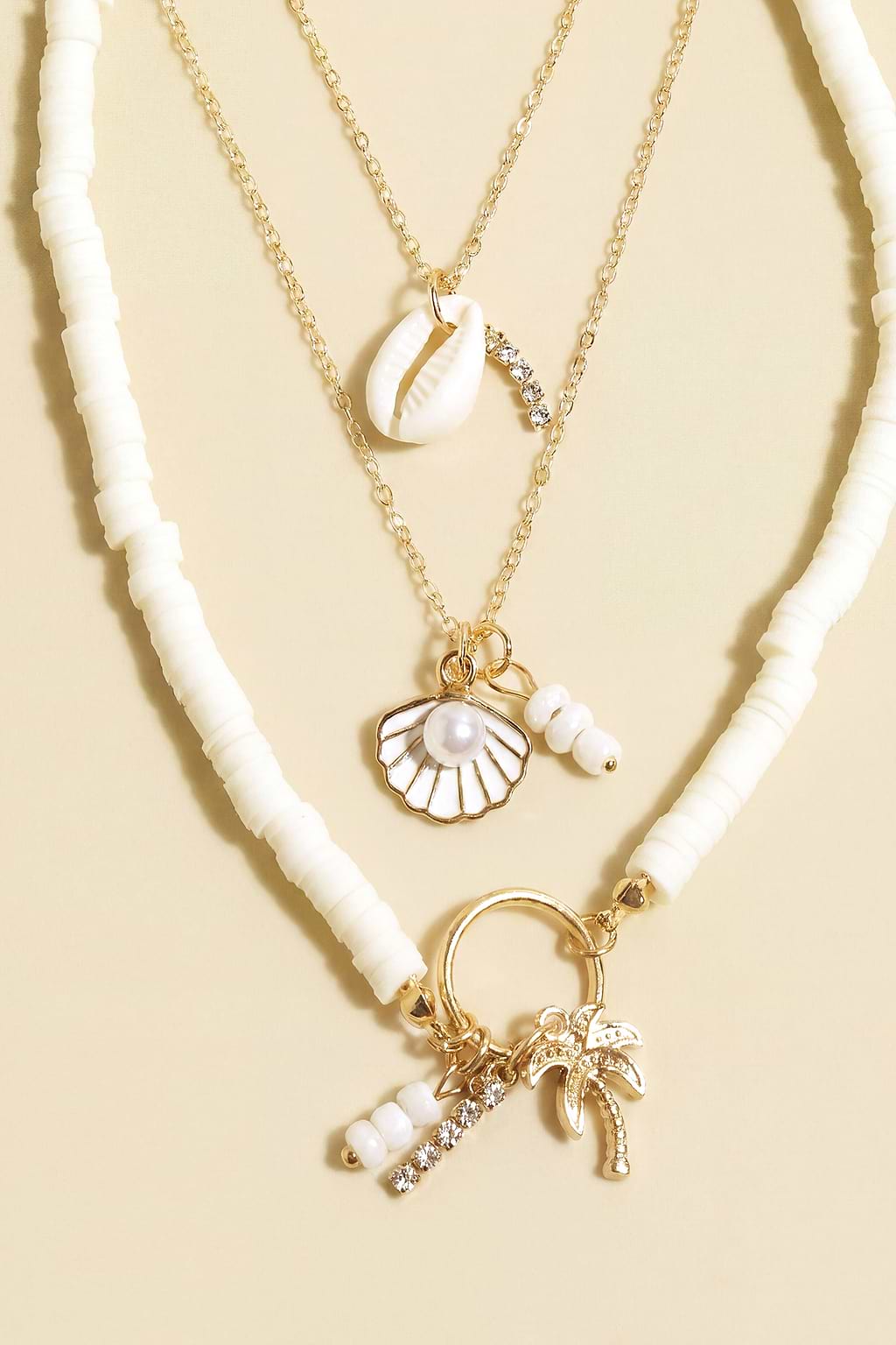 Conjunto de collar y collar de oro con diseño de conchas marinas