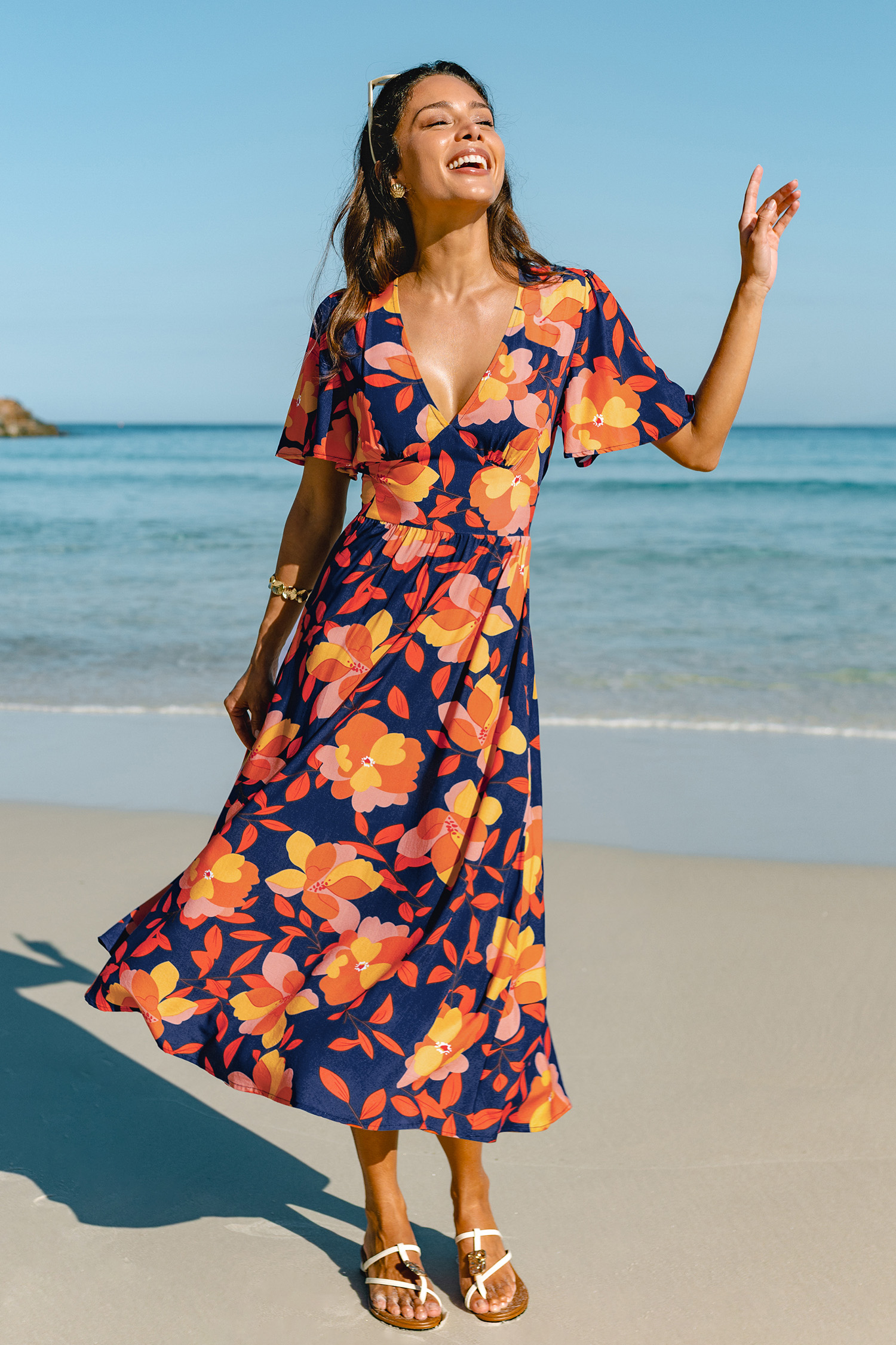 Maxi-jurk met bloemenprint en zonsondergangmotief