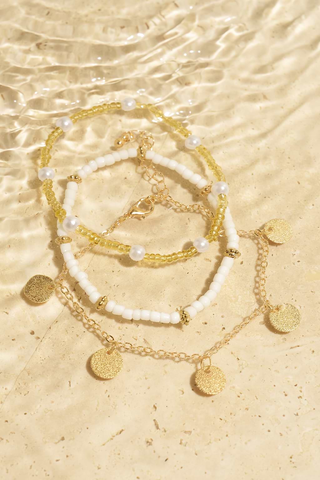 Set di cavigliere color oro 