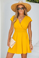 Embrace summer elegance with the Tinsley Light Green V-Neck Tassel Split Cover-Up.